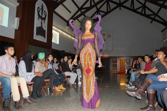 Student in butterfly-inspired purple dress