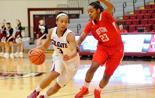 Randyll Butler dribbles down the court against a Boston University opponent