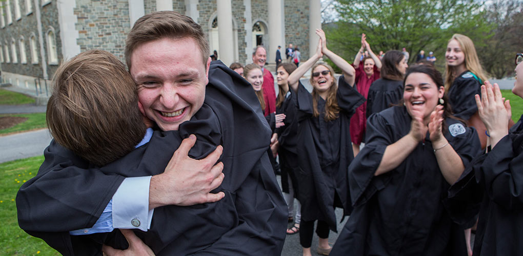 Nathan Fritz ’16 embraces his friend Justin Loscalzo ’16 while their other mates from first year applaud