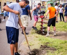 Students using tools to dig.