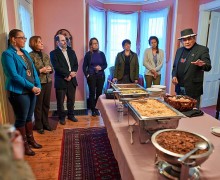 Faculty and students gather as Dennis Banks blesses a meal