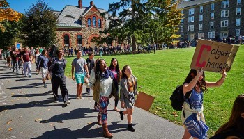 Students march on the quad to end a peaceful sit-in protest.
