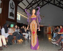 Student in butterfly-inspired purple dress