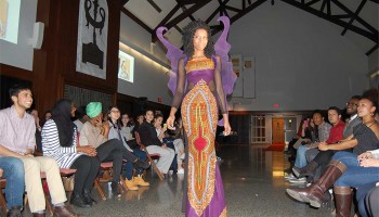 Student in butterfly-inspired purple dress