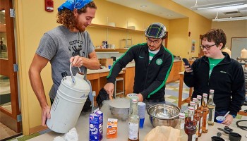 Students make ice cream in a laboratory