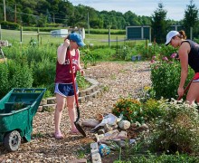 Students work in the community garden