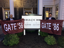 Mike ’56 and Ron Costanzo ’86 outside the Colgate Inn with flags for their respective class years