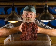 Jim Shaw holding a handful of worms